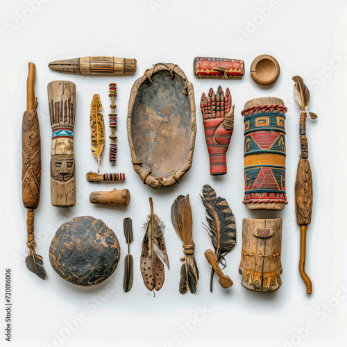 Top view of native americans tribes daily life items, wooden and feather objects of use flat lay on white background