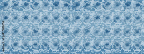 Waffle towel with a continuous pattern in a light blue color. A vector background of a cotton or linen napkin or tablecloth. Kitchen fabric swatch