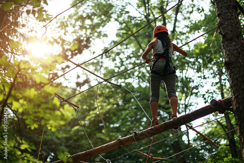 A person balances on a rope or narrow beam.