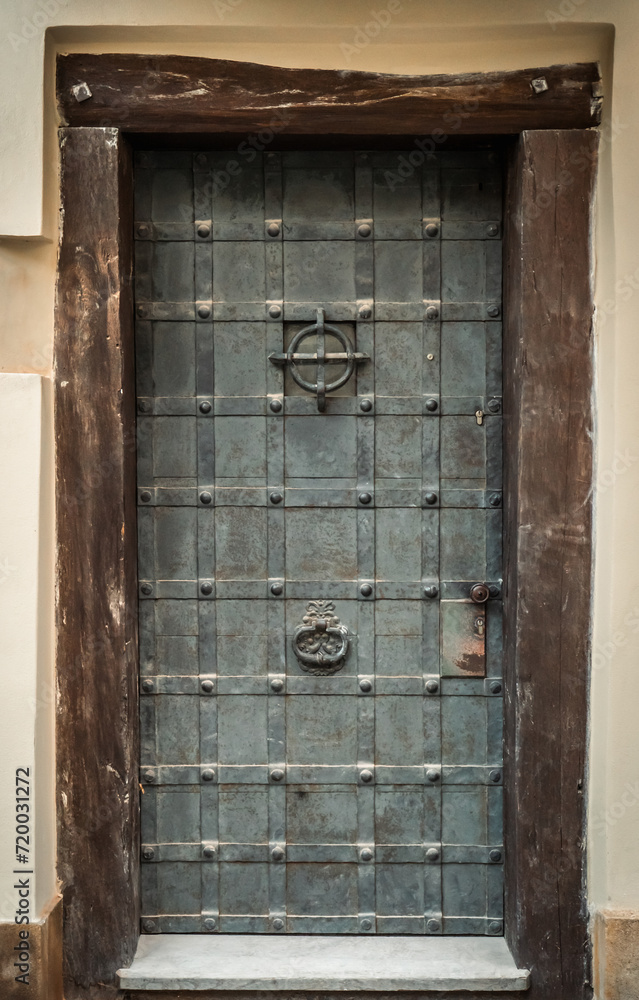 Old medieval reinforced metal door Old medieval reinforced metal door