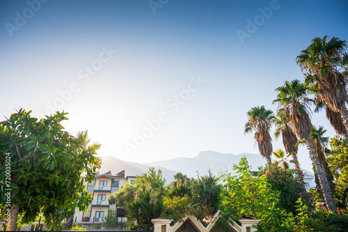 Summer sunny day on the shores of the Mediterranean Sea, Kemer city, Antalya, Turkey. All-inclusive holiday at the Türkiye hotel. Beautiful view with mountains in the background. Summer holidays.