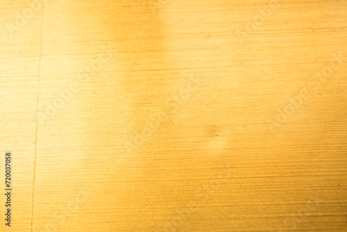 Golden metal elements against a radiant background