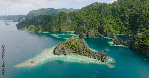 Tropical Islet with transparent turquoise water. Twin Lagoon in Coron, Palawan. Philippines. photo