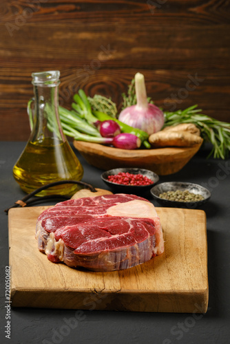 Raw beef ossobuco on chopping board