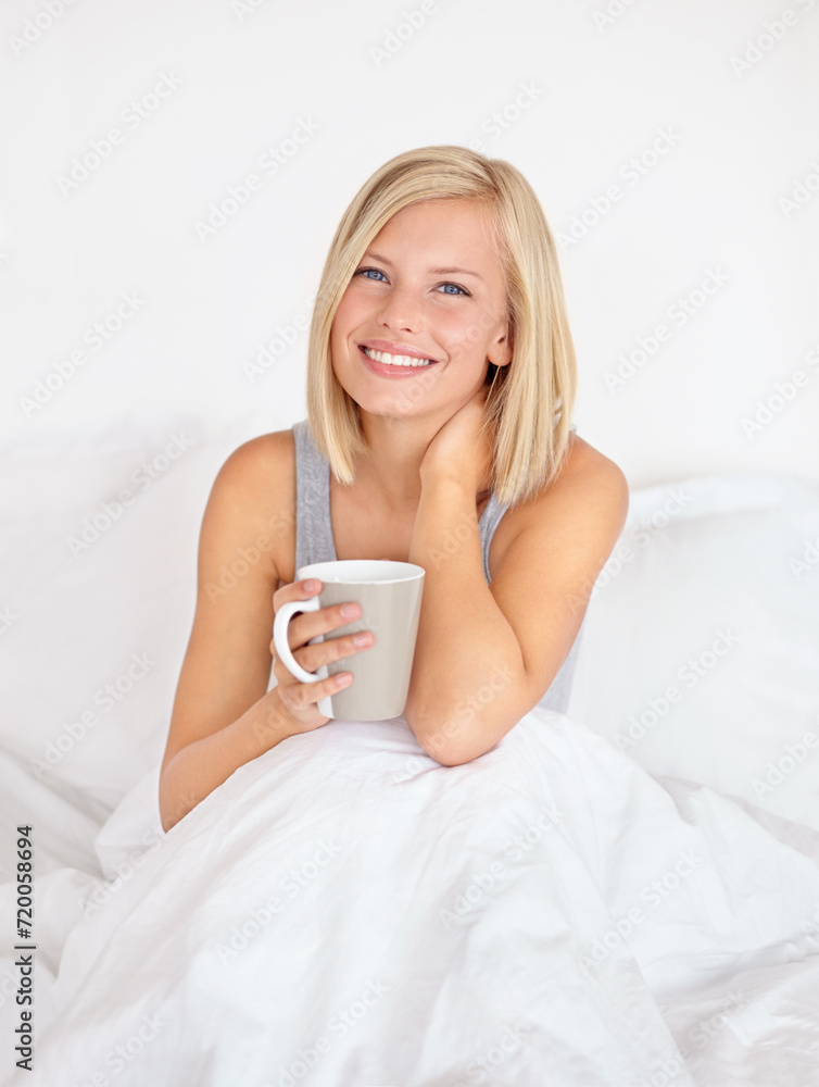 Woman, portrait and coffee in bedroom for morning relax or home beverage for comfort, peace or happy. Female person, face and smile or drinking mug on duvet or warm caffeine for vacation, rest or tea