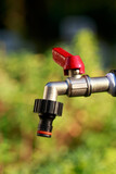 water tap on green background