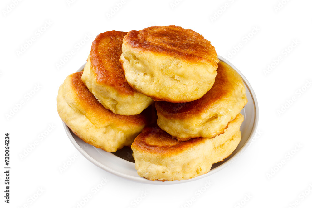Plate with pile of homemade pancakes on white background.