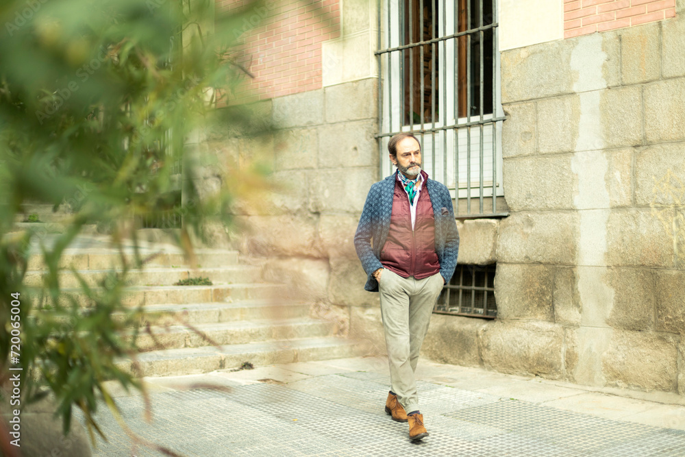attractive adult man photographed unexpectedly while walking down the street