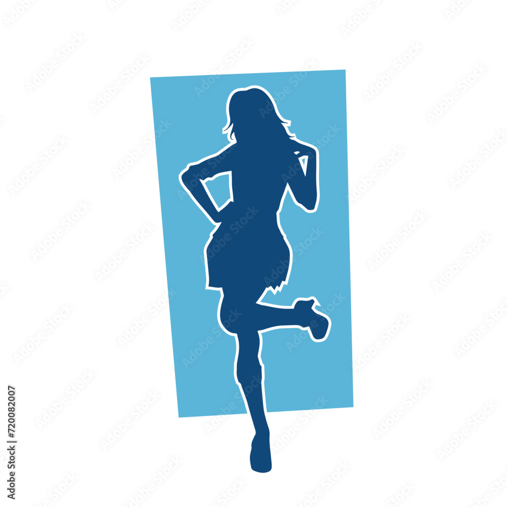 Silhouette of a female dancer wearing mini skirt in action pose. Silhouette of a slim woman dancing happily.