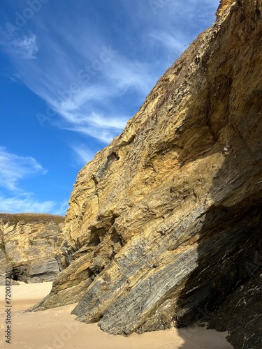 sandstone rock in the blue sky background, ocean rocky coast