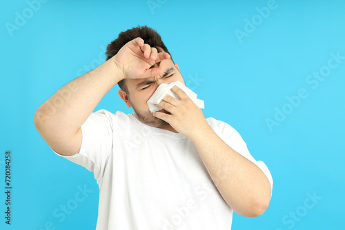 Obraz na płótnie Upset overweight man on a blue background.