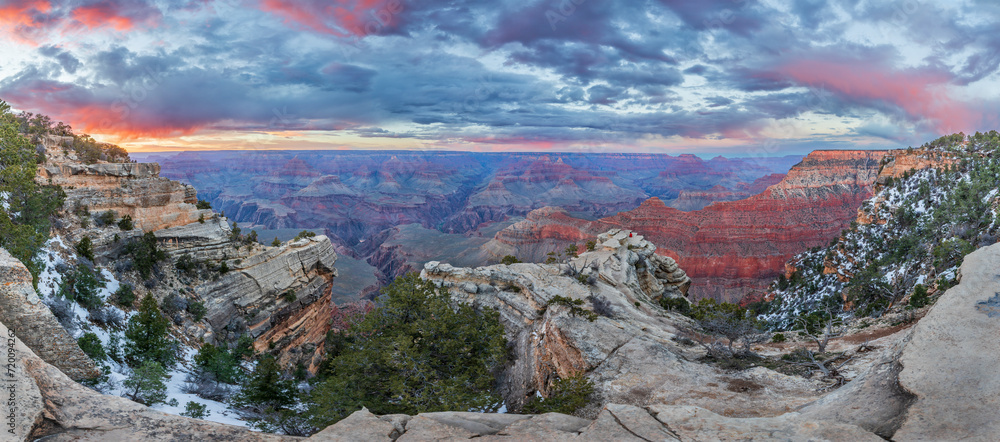 People admire the incredible sunset views of Grand Canyon National Park, Northern Arizona, USA.