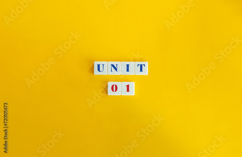 Unit 1. Text on Block Letter Tiles and Icon on Flat Background. Minimalist Aesthetics.