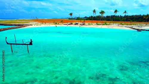 Maldives - Huraa Island - Bathing beach with water swing photo