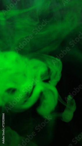 vertical green smoke dark background