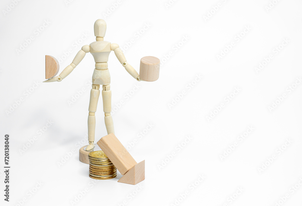 Wooden doll with wooden toy block isolated on white background. business or creative concept Wooden doll with wooden toy block isolated on white background. business or creative concept