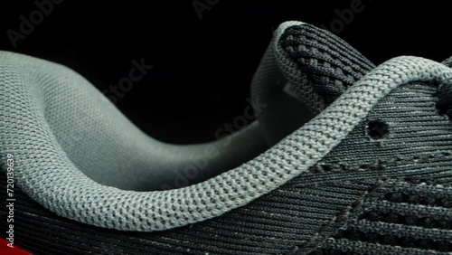 Running shoes made from mesh fabric for better ventilation and lightness. Dolly slider, close up. photo