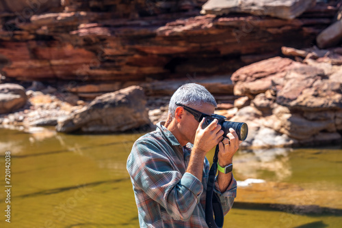 Photographer along the river trail to Murchison River in Kalbarri National Park, Western Australia