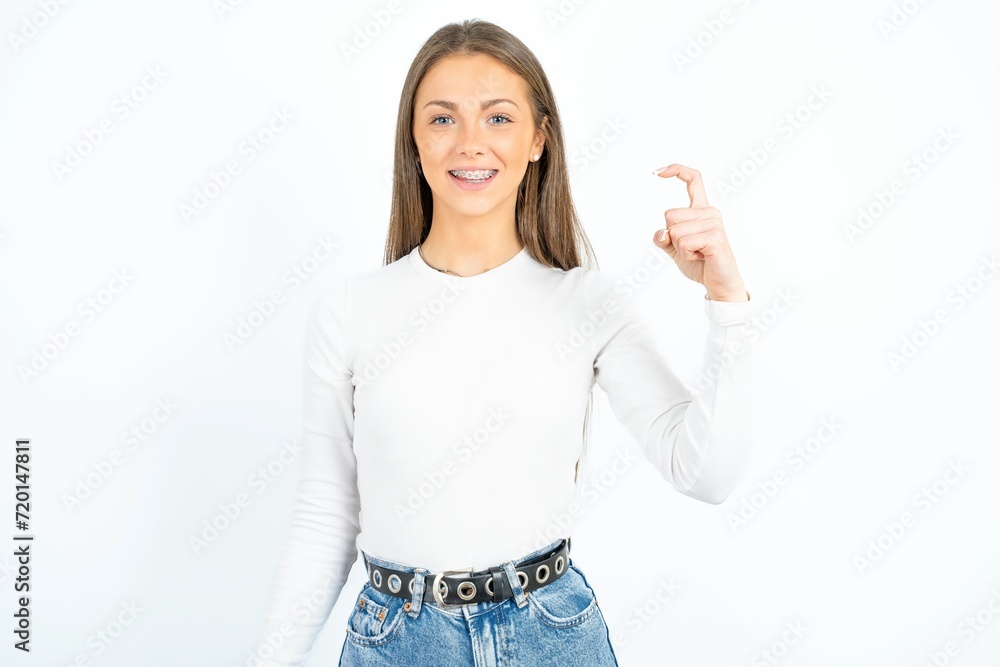 young beautiful girl wearing white T-shirt pointing up with fingers number nine in Chinese sign language Jiu young beautiful girl wearing white T-shirt pointing up with fingers number nine in Chinese sign language Jiu