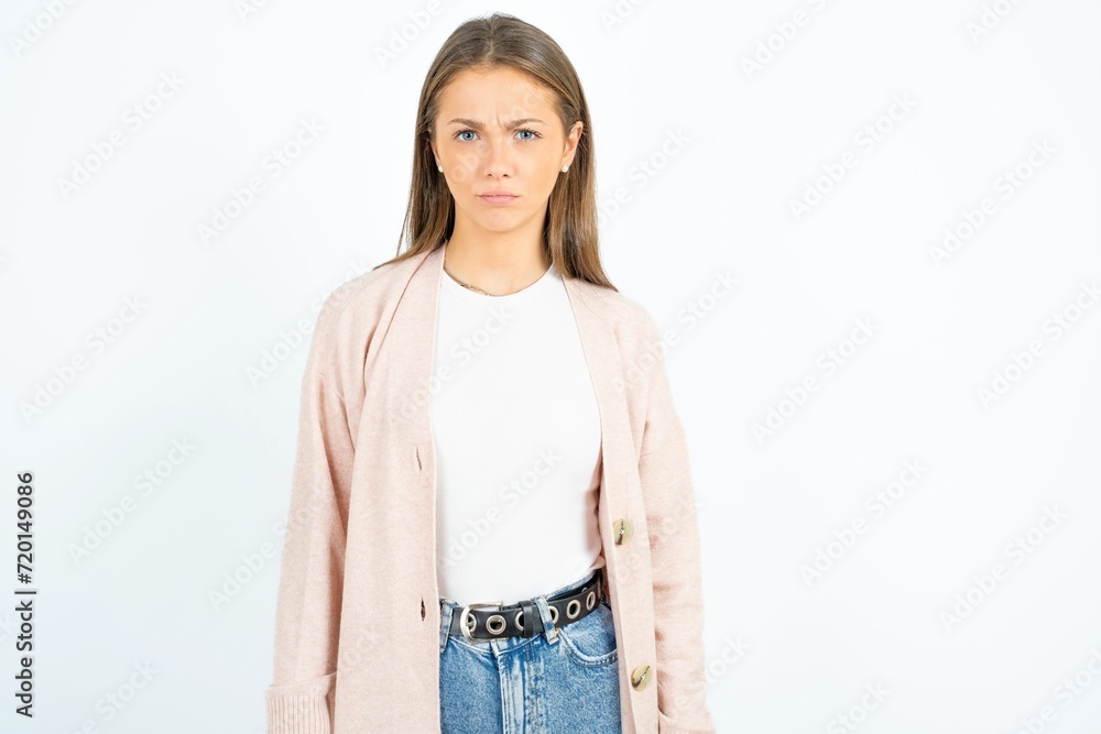 Obraz premium beautiful girl wearing casual clothes Pointing down with fingers showing advertisement, surprised face and open mouth