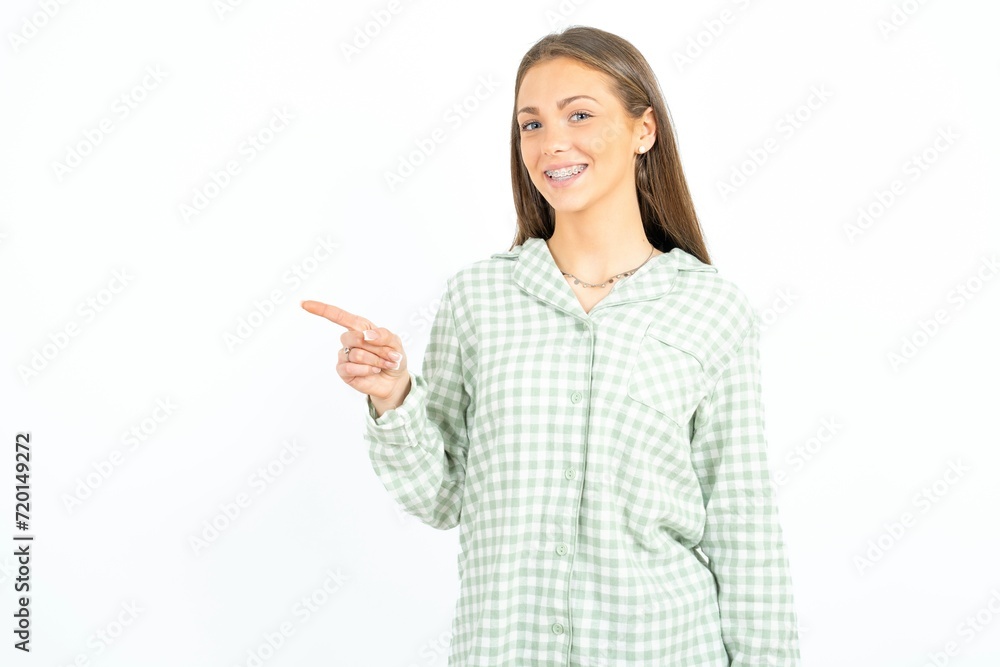 Profile photo of Beautiful young woman wearing green plaid pyjama indicate finger empty space offer Profile photo of Beautiful young woman wearing green plaid pyjama indicate finger empty space offer