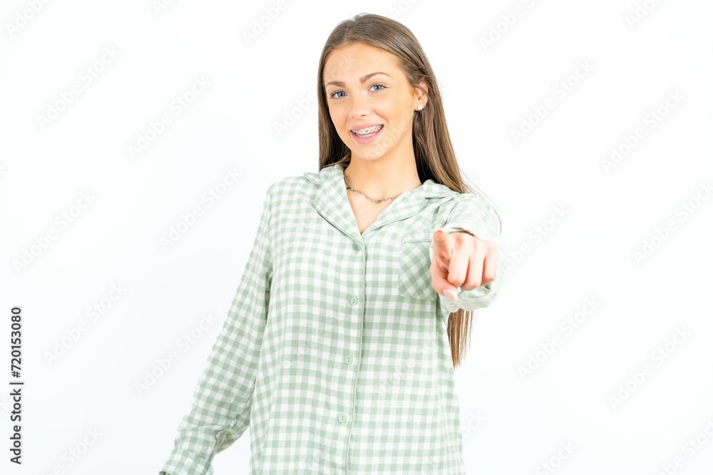 Excited positive Young beautiful woman standing over white studio background points index finger directly at you, sees something very funny. Wow, amazing Excited positive Young beautiful woman standing over white studio background points index finger directly at you, sees something very funny. Wow, amazing