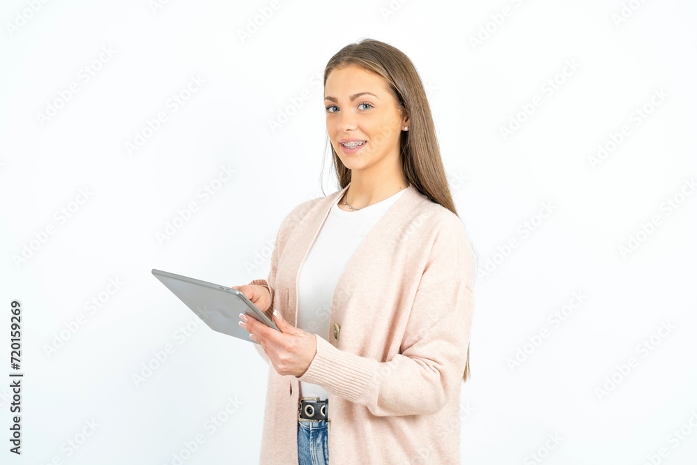 Photo of happy cheerful smart woman hold tablet browsing internet Photo of happy cheerful smart woman hold tablet browsing internet
