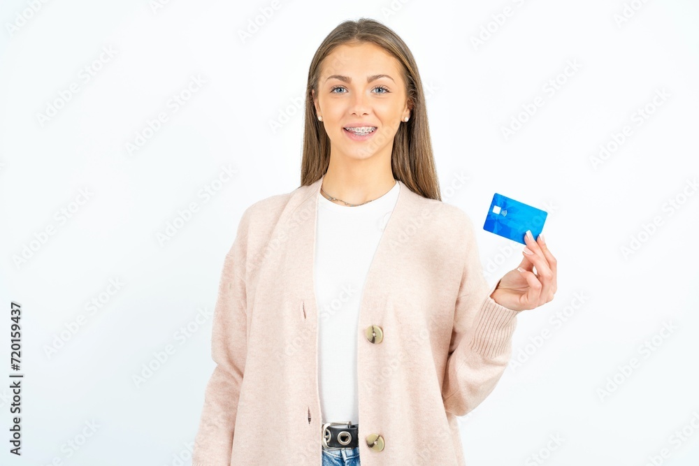 Photo of happy cheerful smiling positive Young beautiful woman recommend credit card