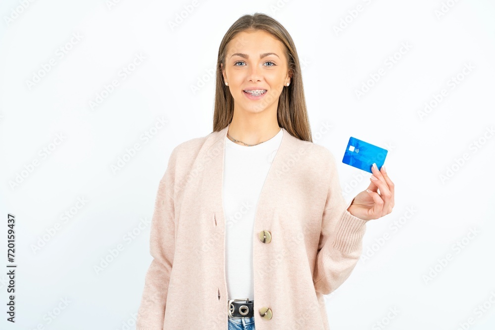 Photo of happy cheerful smiling positive Young beautiful woman recommend credit card Photo of happy cheerful smiling positive Young beautiful woman recommend credit card