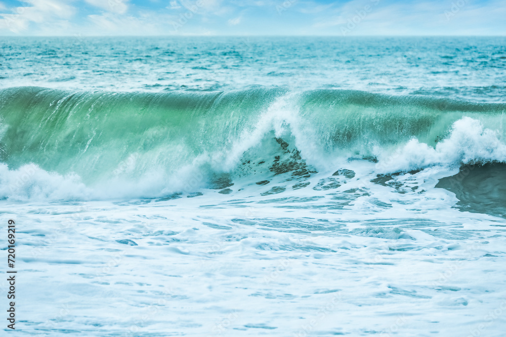 Wave splashing close-up. Crystal clear sea water, in the ocean in San Francisco Bay, blue water, pastel colors.