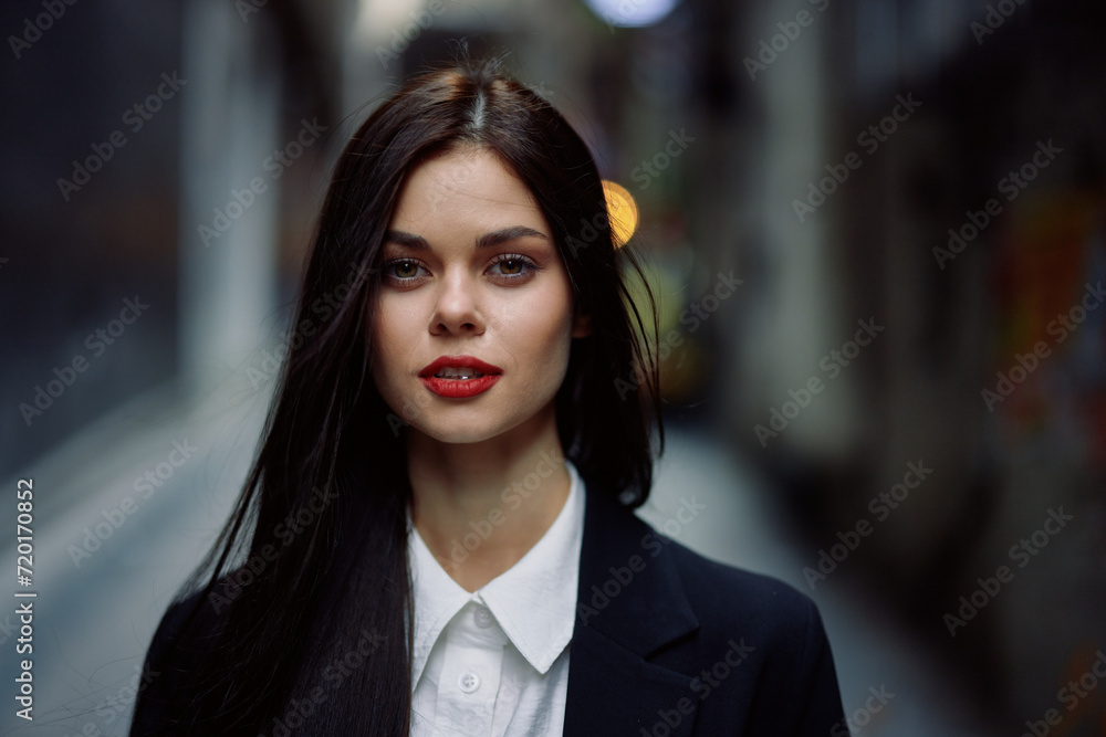 Fashion woman dramatic portrait tourist in stylish clothes in jacket and red beret walking down narrow city street flying hair, travel, French style, cinematic color, retro vintage style. Fashion woman dramatic portrait tourist in stylish clothes in jacket and red beret walking down narrow city street flying hair, travel, French style, cinematic color, retro vintage style.