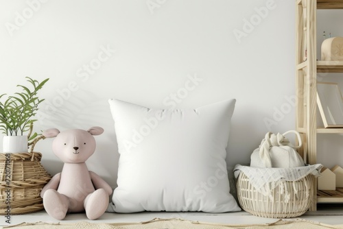 Soft pink plush toy beside a white pillow in a child's room with wooden accents. photo