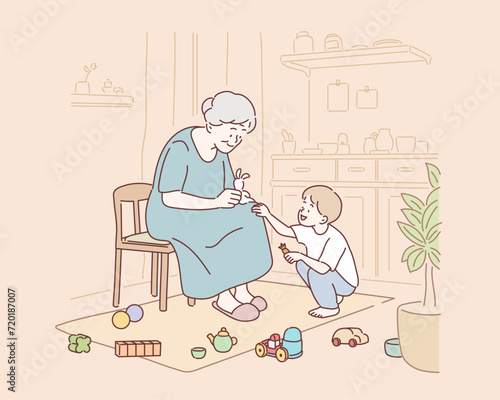 Grandmother is taking care of her grandson while playing dolls at home. Hand drawn style vector design illustrations.