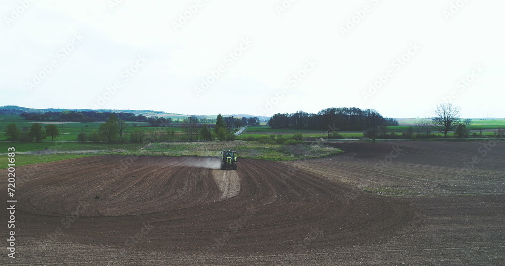 Farmer plowing field. Agriculture background.