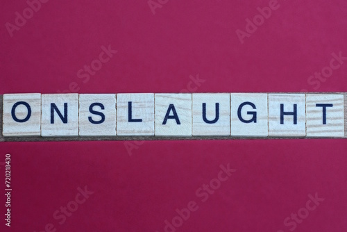 Tableau sur toile gray word onslaught from small wooden letters on a red table