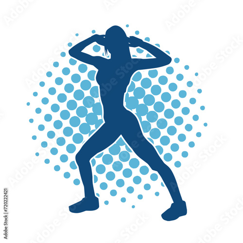 Silhouette of slim female doing exercise. Silhouette of a sporty woman doing gym workout pose. 