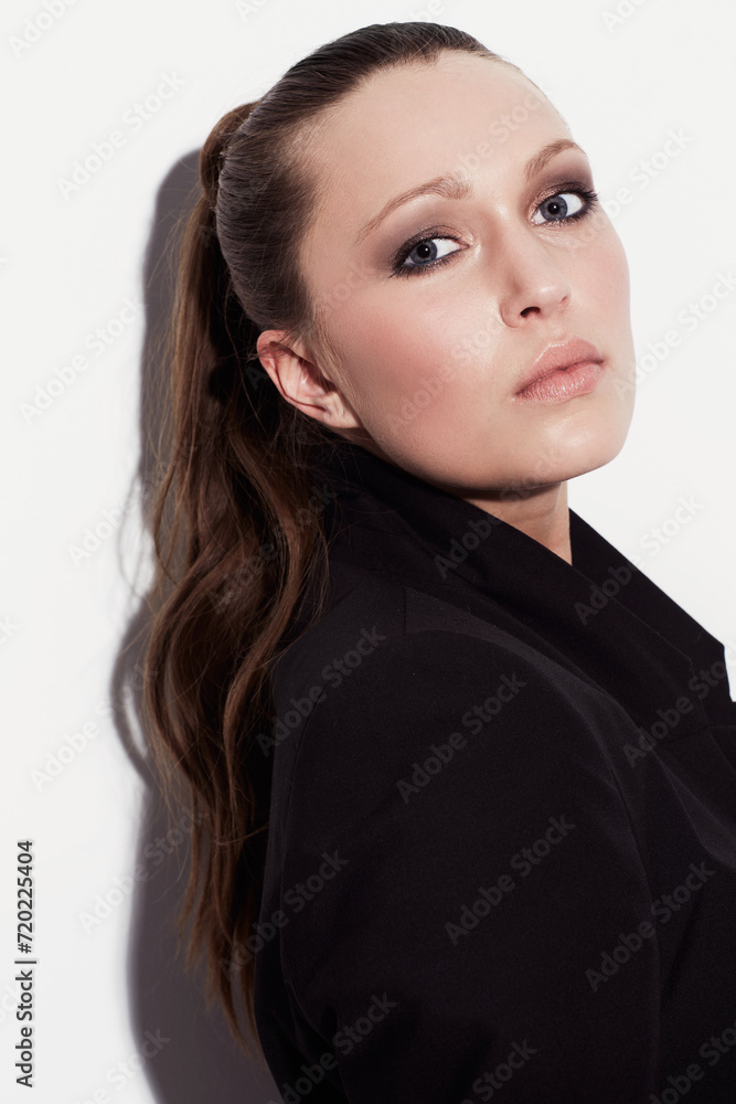 Portrait, fashion and beauty of serious woman in studio isolated on a white background. Face, makeup and young model or person in cosmetics, stylish blazer and trendy clothes on a backdrop in Spain Portrait, fashion and beauty of serious woman in studio isolated on a white background. Face, makeup and young model or person in cosmetics, stylish blazer and trendy clothes on a backdrop in Spain