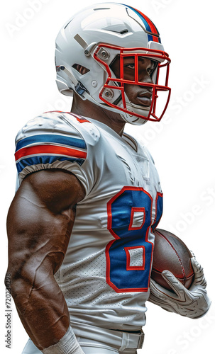 An American football player in a white helmet with a red grille and a white jersey stands sideways with a ball in his white hand
