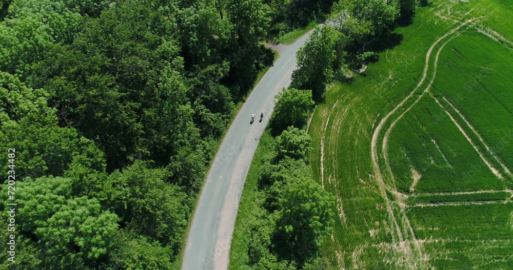 two cyclist riding bycicle aerial view two cyclist riding bycicle aerial view