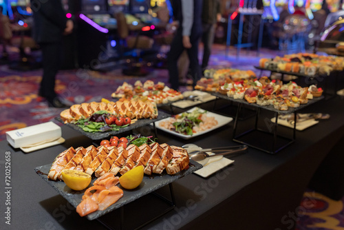light snacks for the holiday, catering. Various light snacks. Catering plate. Assortment of sandwiches on the buffet table. meat, vegetable canapes.