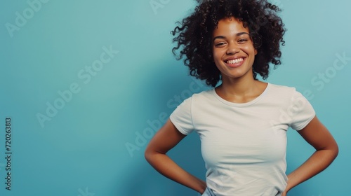 A spirited young woman with bouncy locks and a radiant smile photo