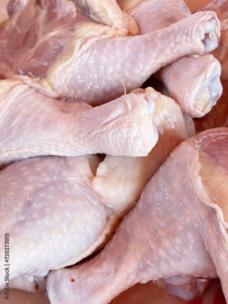 raw chicken drumsticks on the counter of the supermarket raw chicken drumsticks on the counter of the supermarket