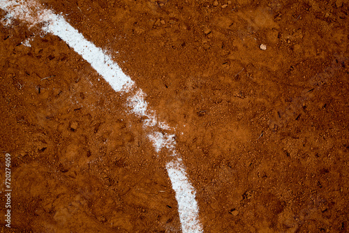 red clay baseball field and various views of the baseball home plate