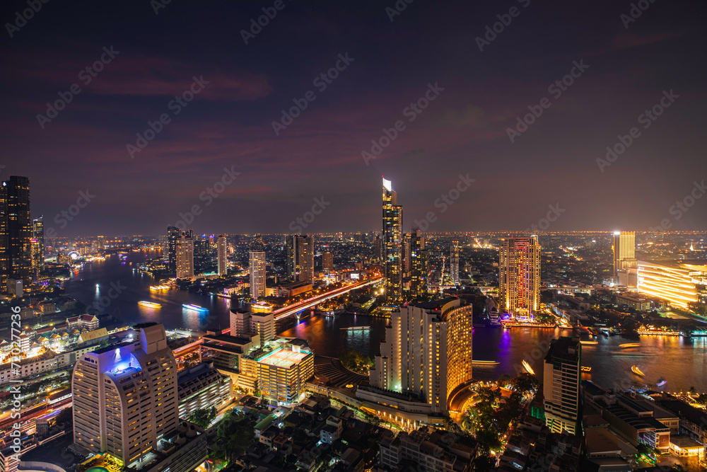 Beautiful cityscape Bangkok river boat business district and residential. In the twilight,