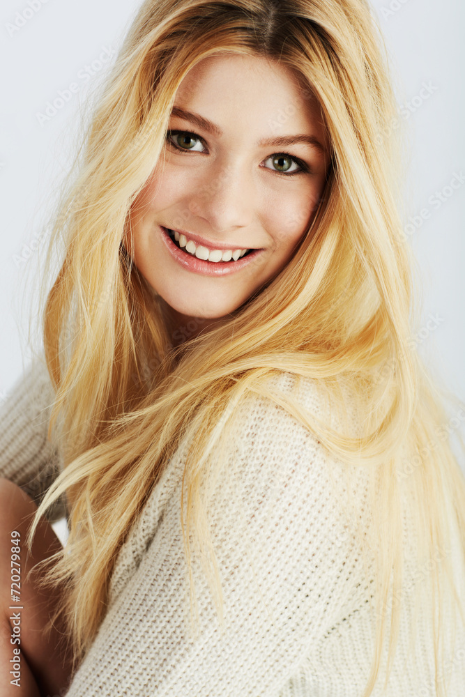 Naklejka premium Fashion, portrait and smile with natural woman closeup in studio on white background for wellness. Face, beauty or aesthetic and happy young blonde model looking satisfied with cosmetic routine