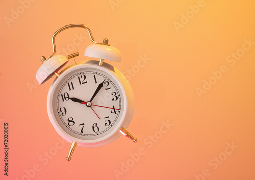 White retro alarm clock. Time to sleep or wake up. Copy space for text.