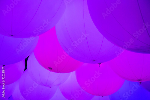 Balloons with colorful light effects creating a rainbow spectrum