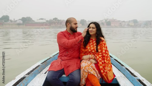 Indian Couple Sitting in a Boat photo