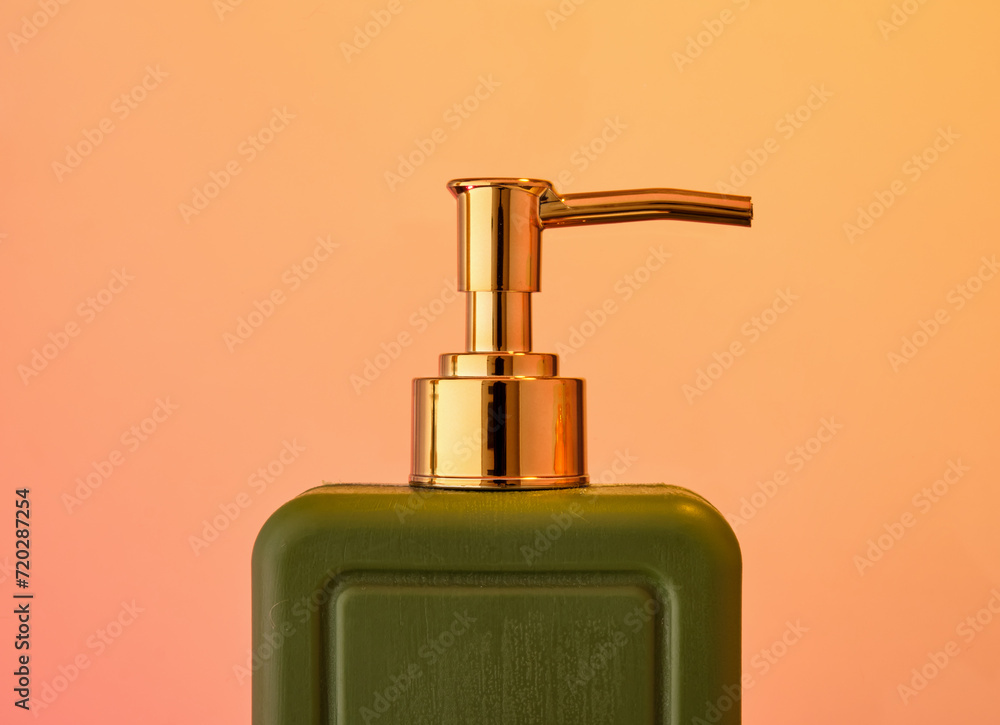 Green deluxe hair shampoo dispenser. Routine in the bathroom. Green deluxe hair shampoo dispenser. Routine in the bathroom.