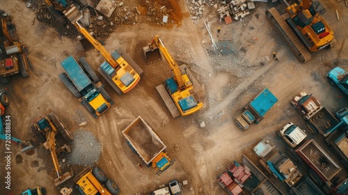 Machinery Power: Witness the Power of a Construction Fleet in Action, As Birds-eye View Unveils Bulldozers, Excavators, and Dump Trucks Ready to Transform the Landscape with Industrial Progress.


